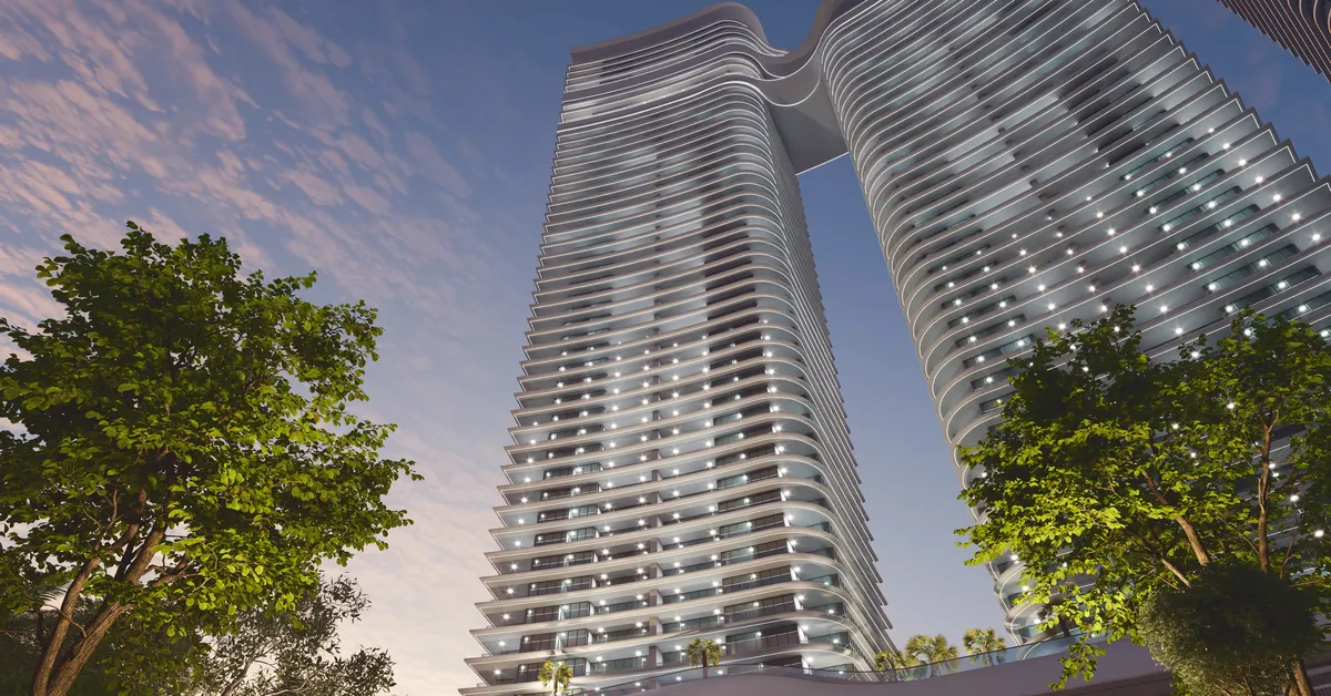نمای شبانه از پایین برج‌های موج‌دار SeaHaven
